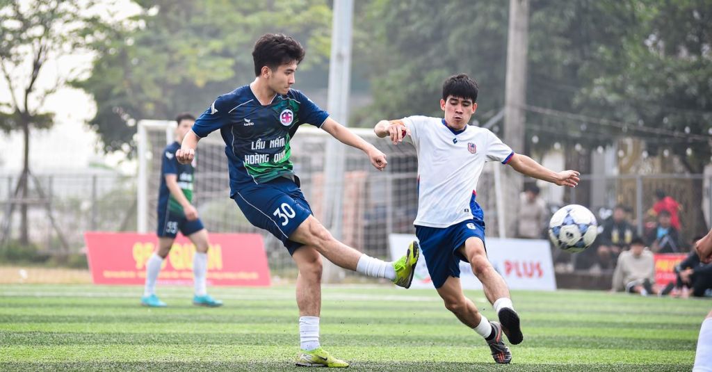 Dynamic soccer match between local teams in Hà Nội, showcasing athletic skills.